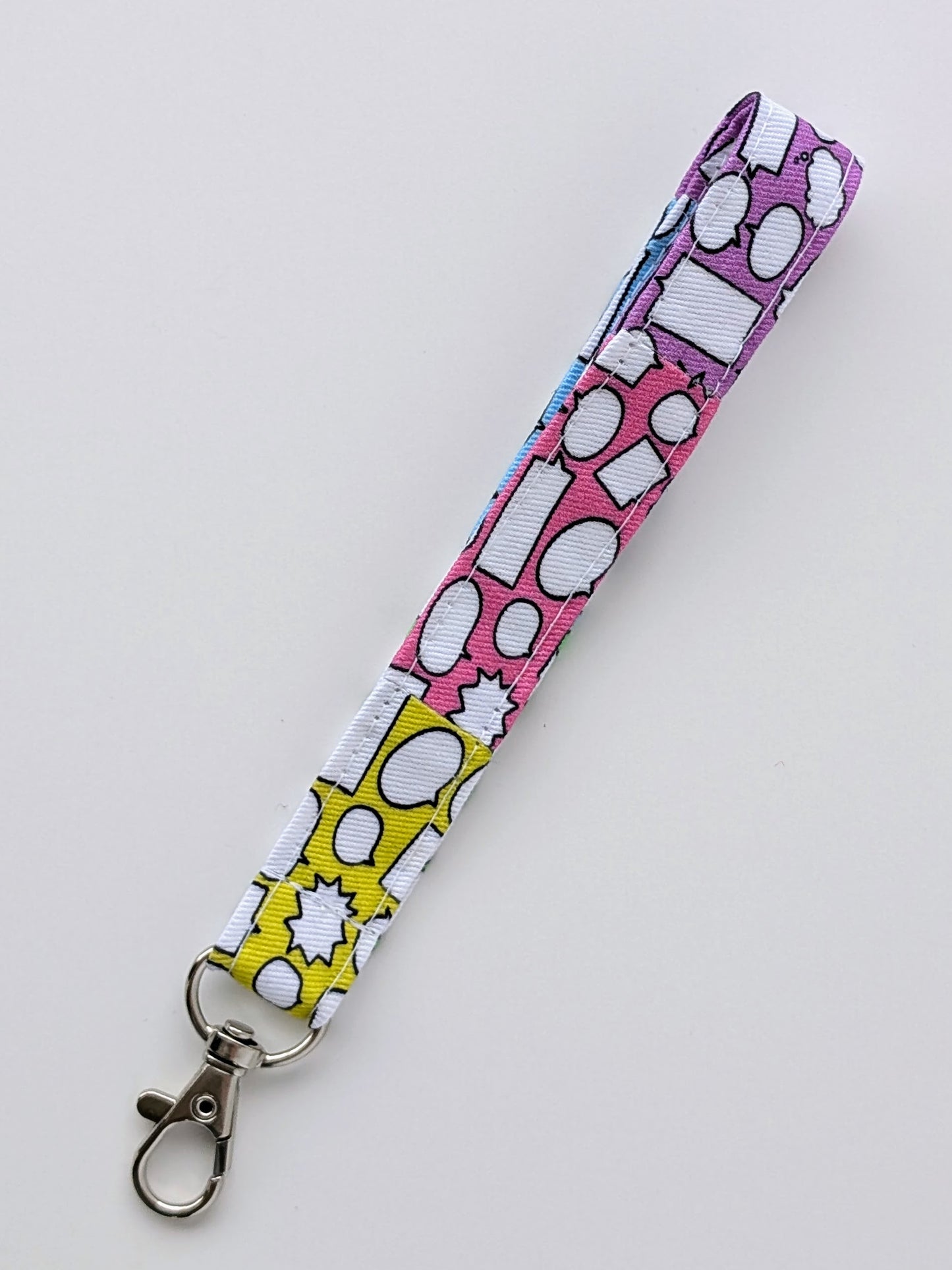 Colorful lanyard with speech bubble pattern on a white background