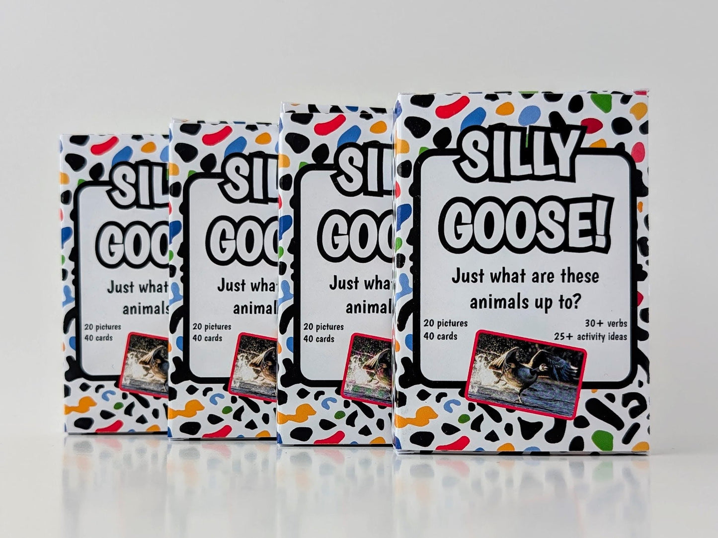 Four boxes of 'Silly Goose!' card game on a white background