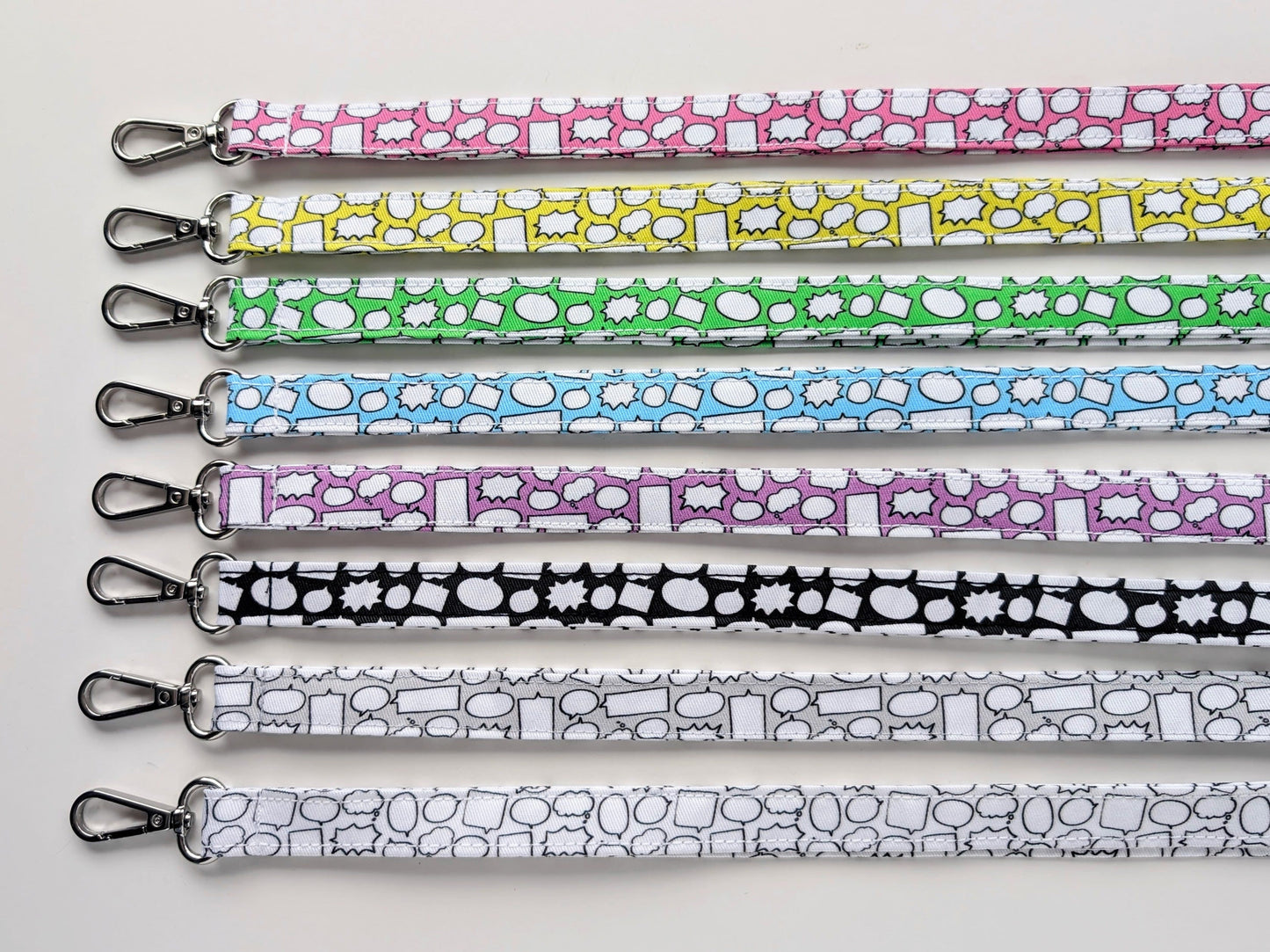 Set of colorful patterned lanyards on a white background