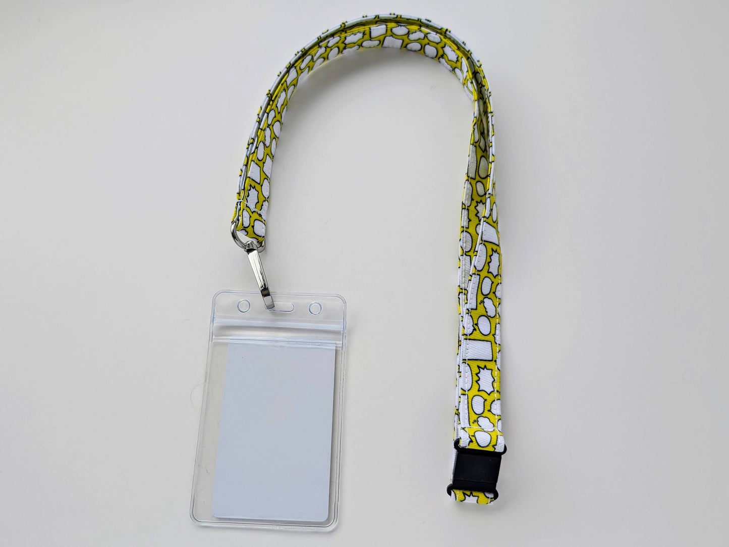 Lanyard with a clear ID badge holder on a light gray background