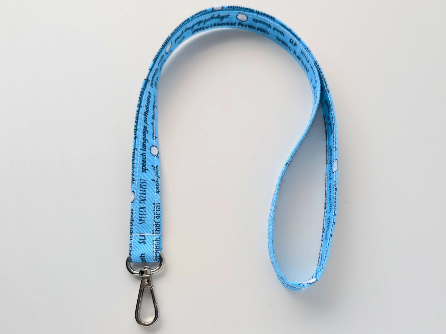 Blue lanyard with text on a light gray background