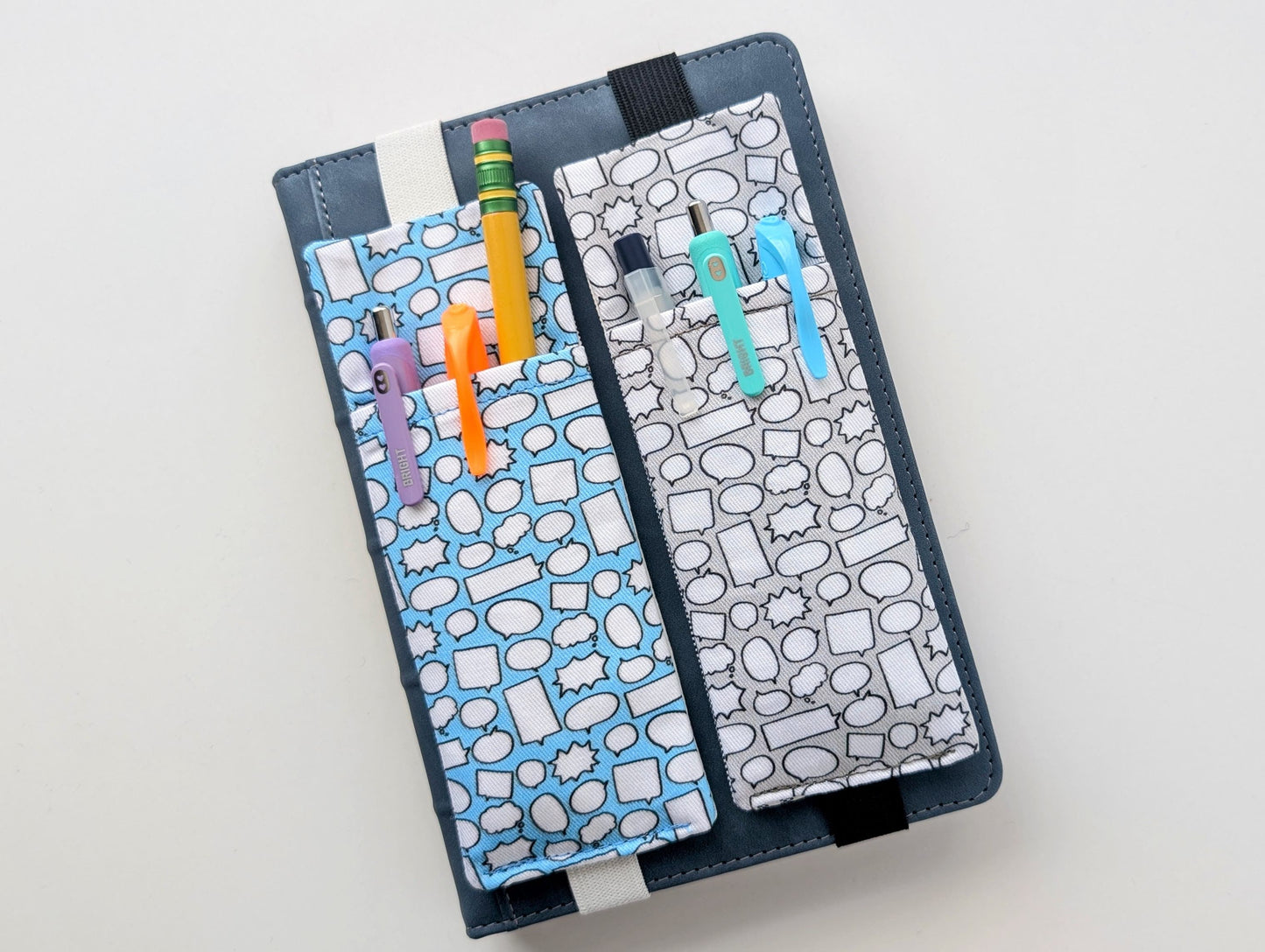 Two pencil cases with colorful pens and markers on a light gray background