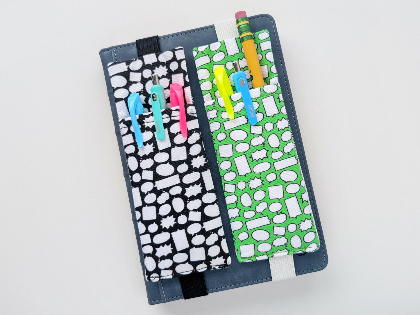 Two fabric pencil cases with patterned designs on a white background