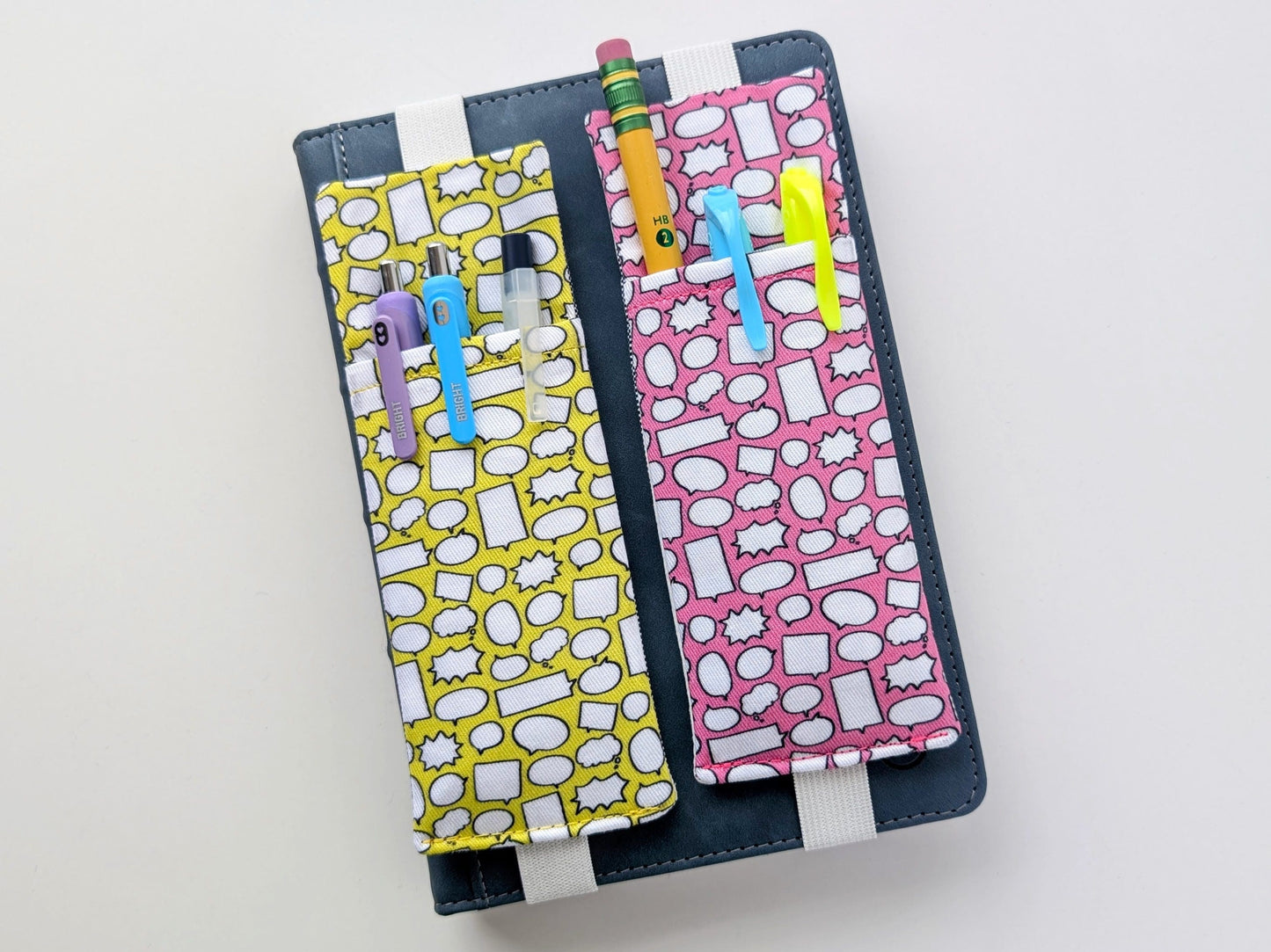 Two colorful pencil cases with colorful designs on a white background