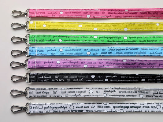 Set of colorful lanyards with text on a white background