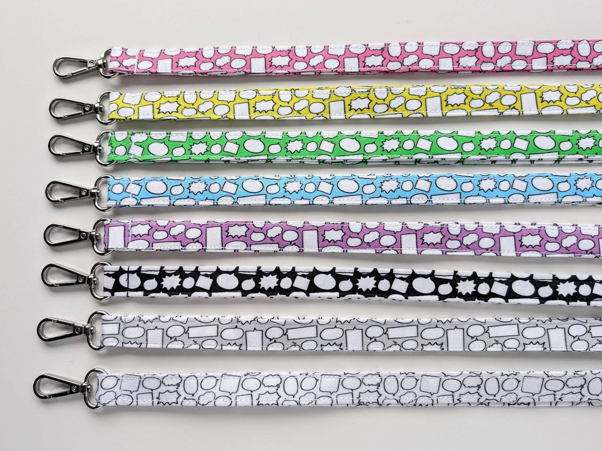 Set of colorful patterned lanyards on a white background