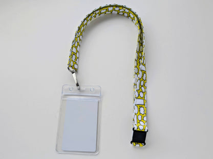 Lanyard with a clear ID badge holder on a light gray background