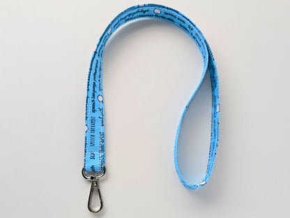 Blue lanyard with text on a light gray background